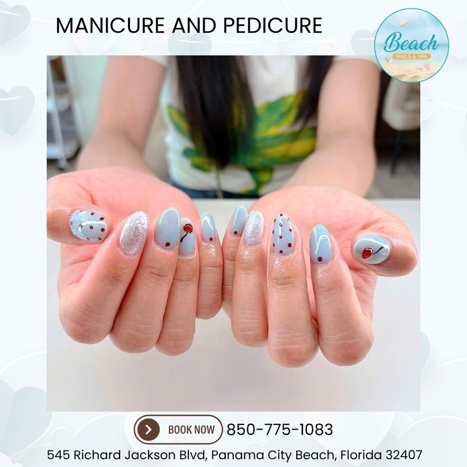 Artistic nail designs displayed on hands.