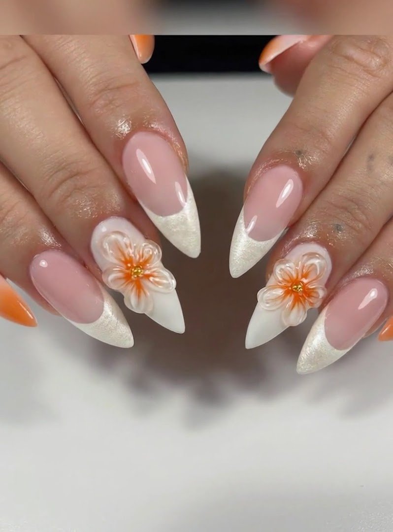 Nail technician shaping polished fingernails.