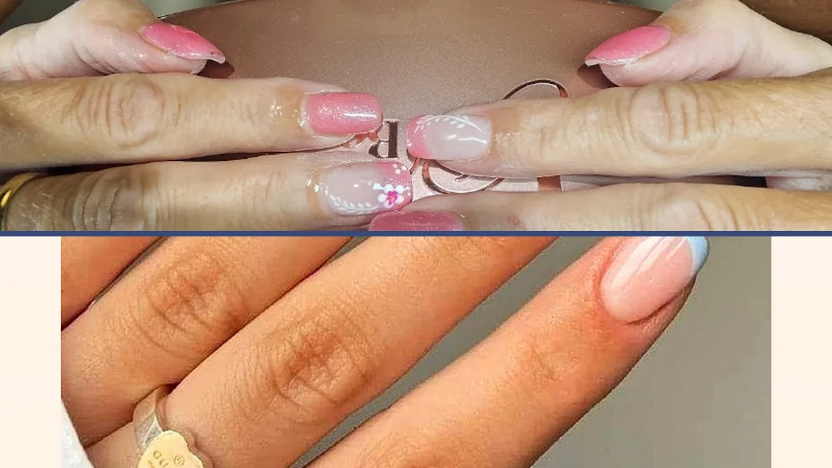 Artistic nail designs displayed on hands.